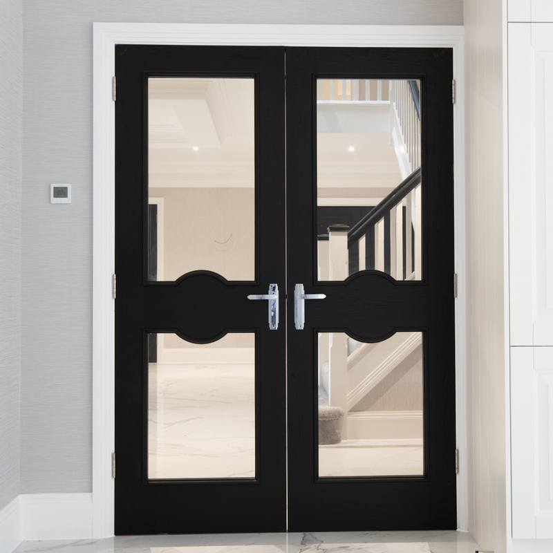 Black double doors with glass panels in a modern interior setting
